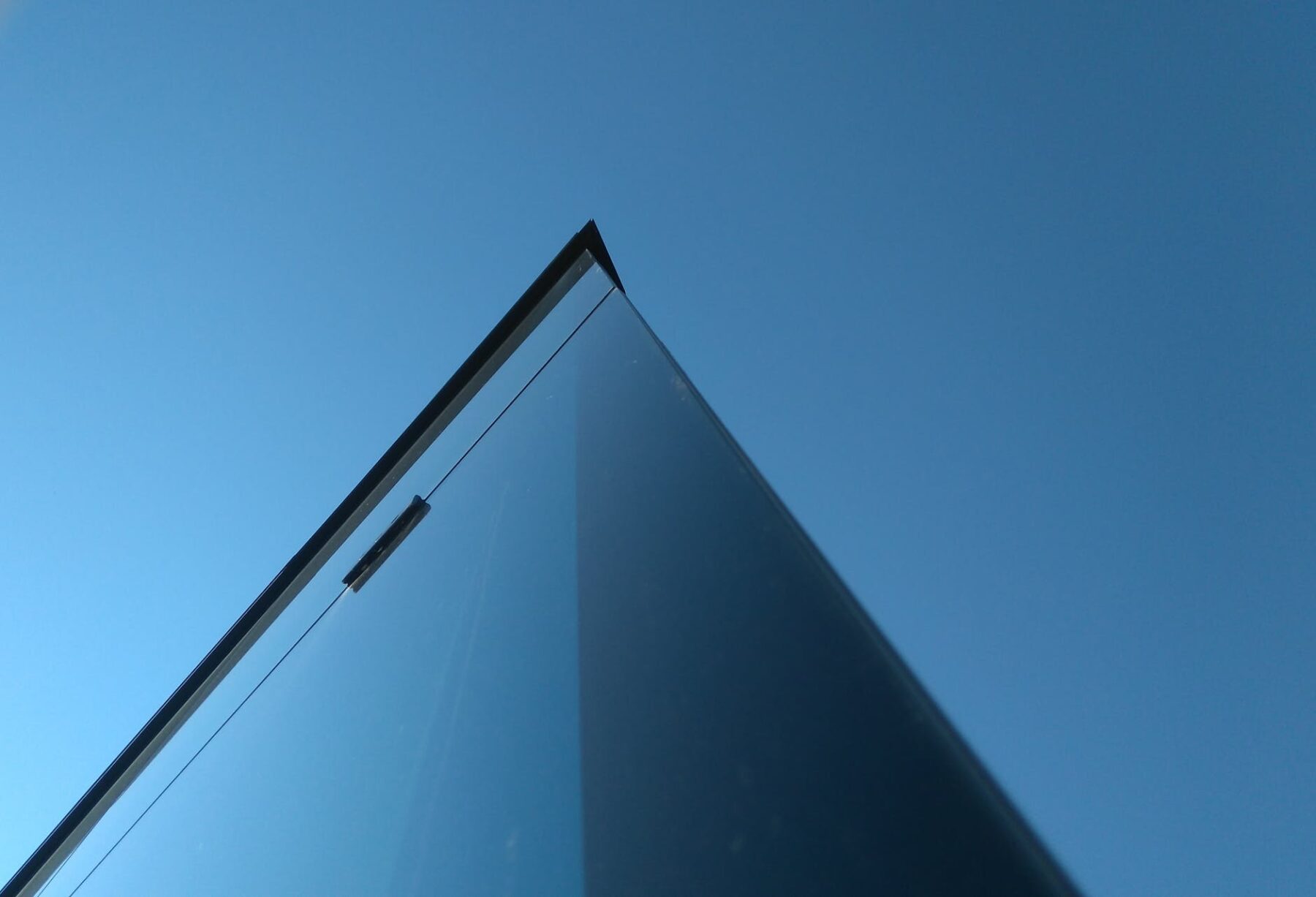 low angle photography of laminated glass building